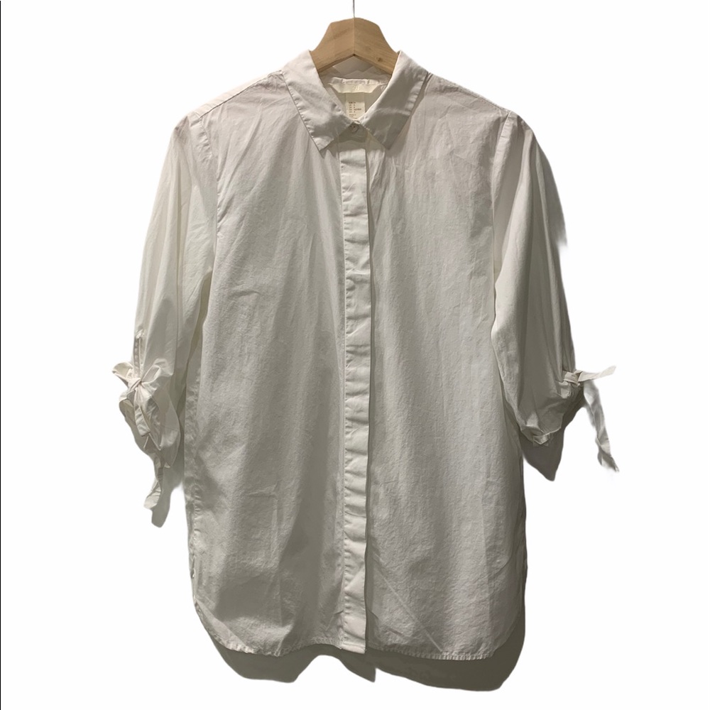 White shirt with ties on sleeves